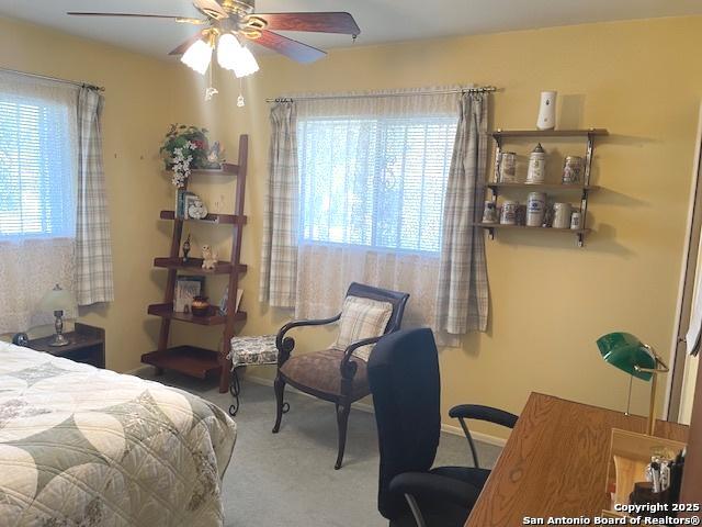 carpeted bedroom featuring a ceiling fan