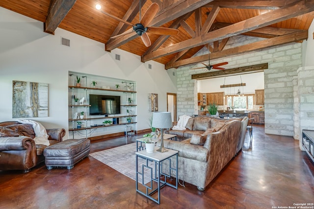 living room featuring high vaulted ceiling, visible vents, and finished concrete floors