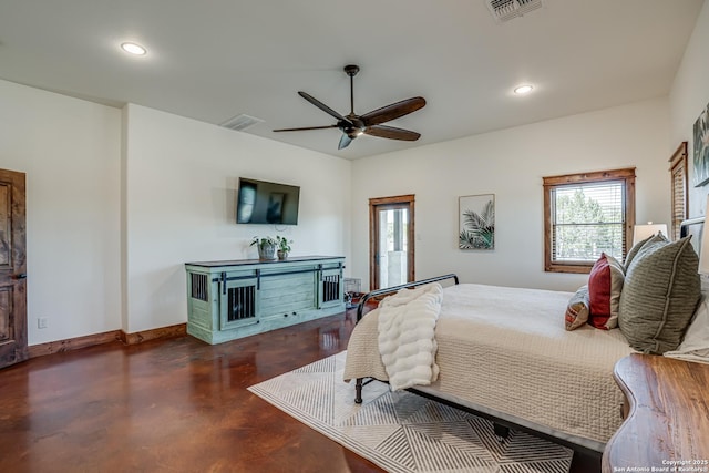 bedroom with baseboards, finished concrete floors, visible vents, and recessed lighting