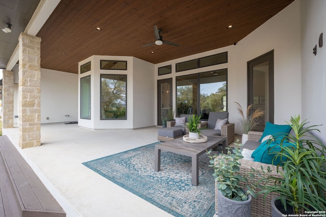 view of patio with outdoor lounge area and ceiling fan