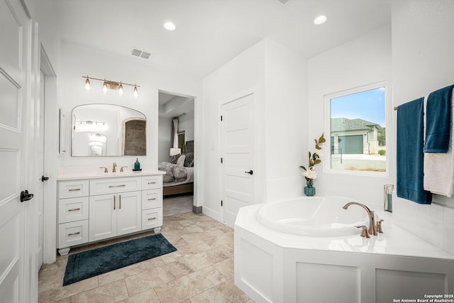 bathroom featuring a garden tub, recessed lighting, visible vents, connected bathroom, and vanity