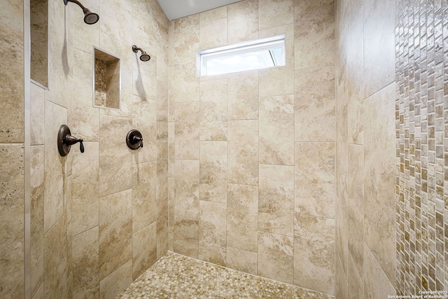 bathroom with tiled shower