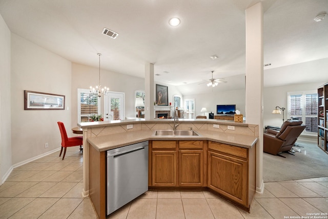 kitchen featuring visible vents, open floor plan, vaulted ceiling, stainless steel dishwasher, and a sink