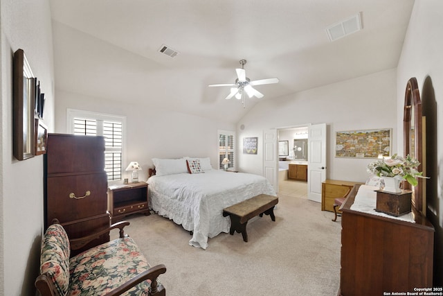 bedroom with vaulted ceiling, ceiling fan, light carpet, and visible vents