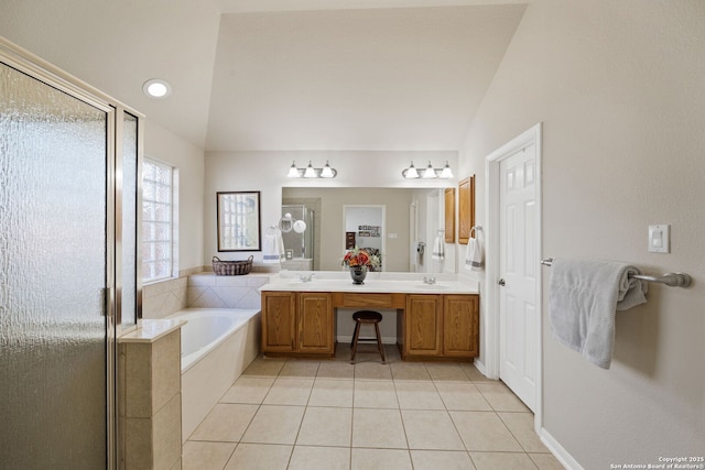 full bath with tile patterned flooring, a shower stall, and a sink