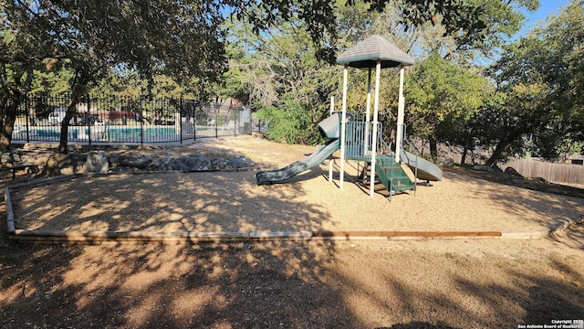 community play area featuring fence