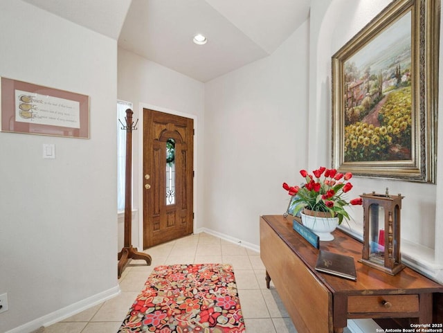 foyer entrance featuring recessed lighting, baseboards, and light tile patterned floors