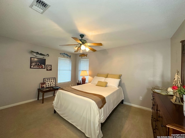 bedroom with ceiling fan, carpet, visible vents, and baseboards