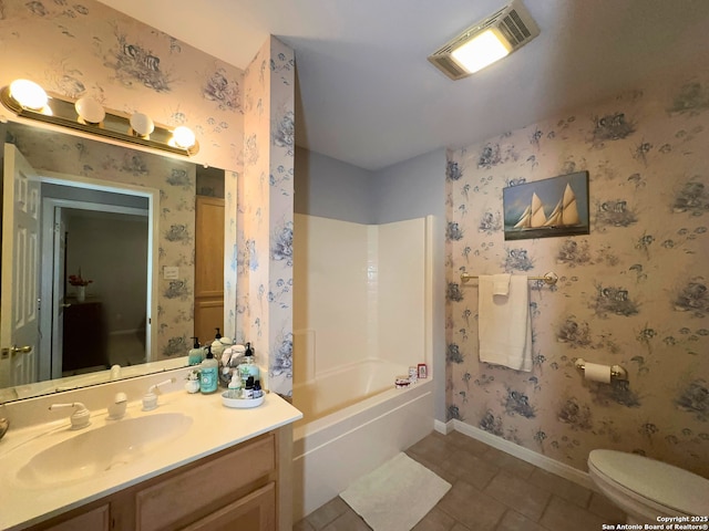 bathroom featuring visible vents, toilet, baseboards, and wallpapered walls