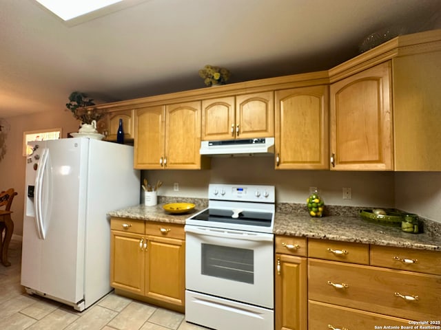 kitchen featuring white appliances and under cabinet range hood