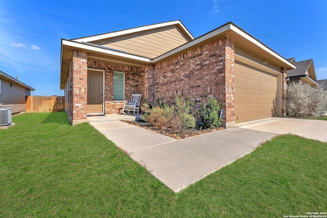 ranch-style home with a garage, covered porch, a front yard, and brick siding