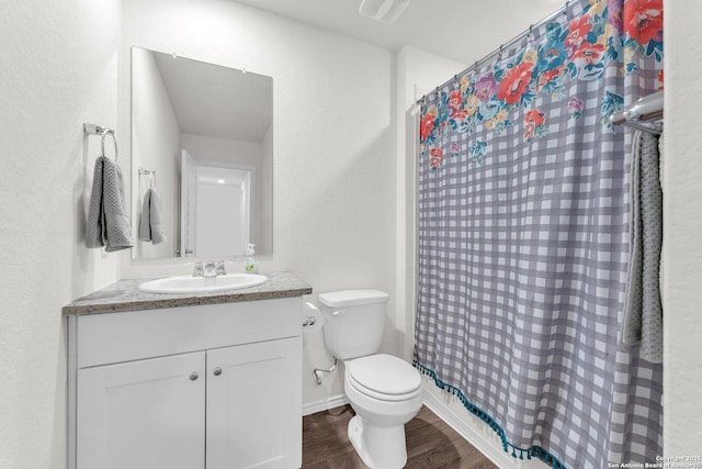 full bathroom featuring visible vents, toilet, a shower with curtain, wood finished floors, and vanity