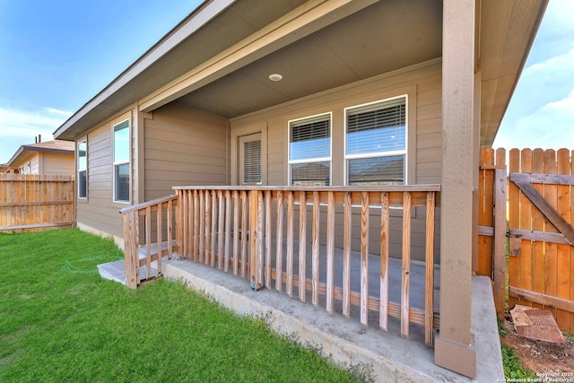 exterior space featuring a yard, fence, and a gate