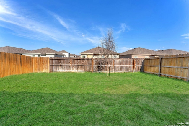 view of yard featuring a fenced backyard