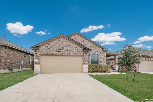 view of front of home featuring an attached garage, driveway, a front yard, and brick siding