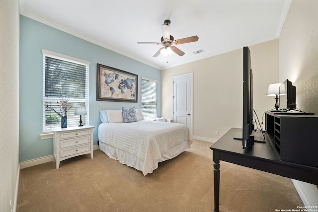 carpeted bedroom featuring multiple windows, visible vents, and crown molding