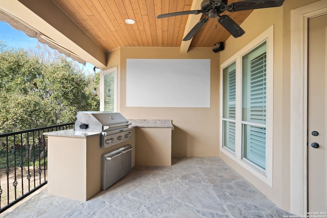 view of patio / terrace featuring a balcony, a grill, and a ceiling fan