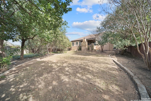 view of yard featuring fence