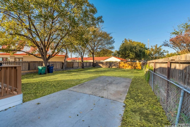 view of yard featuring a patio area and a fenced backyard