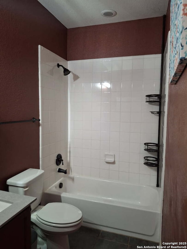 bathroom with  shower combination, vanity, toilet, and tile patterned floors