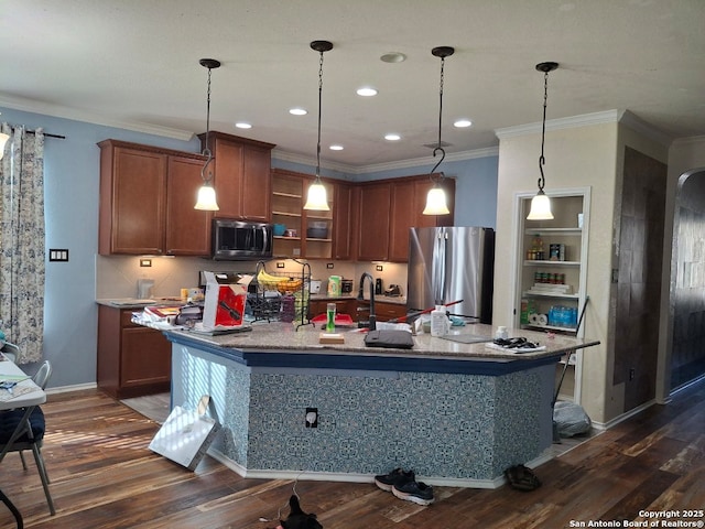 kitchen with stainless steel appliances, pendant lighting, brown cabinetry, and dark wood-style floors