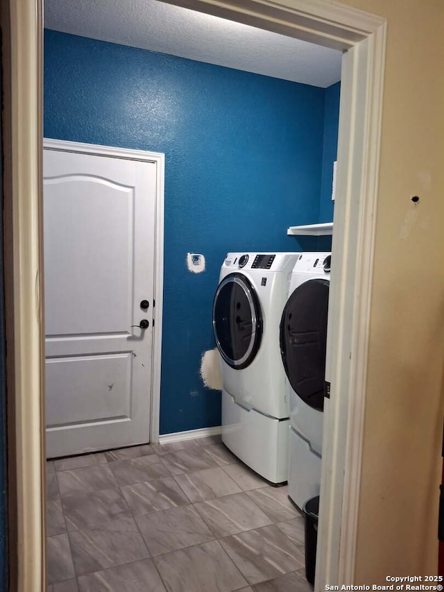 laundry area featuring laundry area and washing machine and clothes dryer