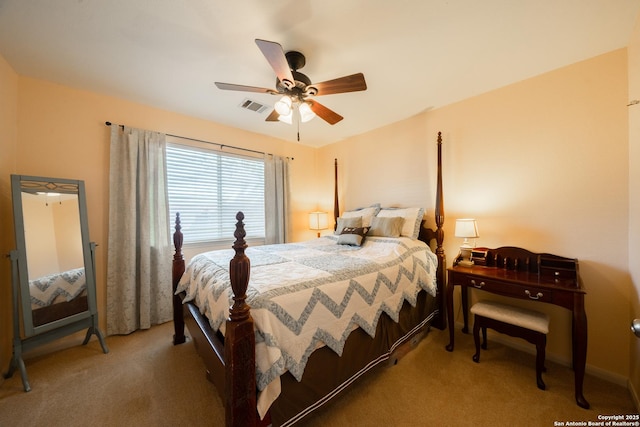 carpeted bedroom with a ceiling fan and visible vents