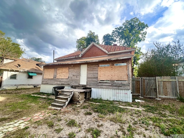 back of property with fence