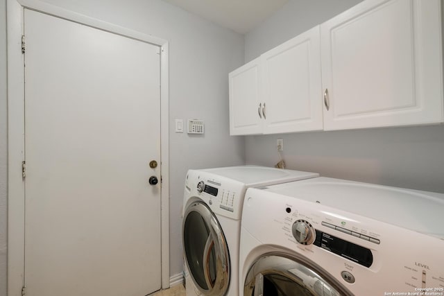 4010 Briarcrest, San Antonio, TX 78247 - laundry area with cabinet space and washing machine and clothes dryer