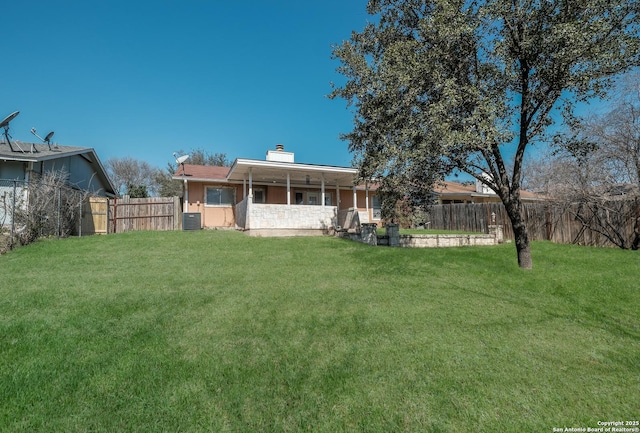 4010 Briarcrest, San Antonio, TX 78247 - exterior space with a chimney, central AC unit, fence, and a yard