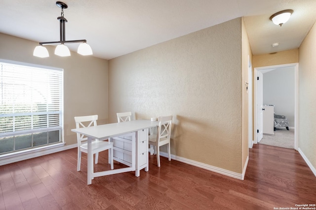 4010 Briarcrest, San Antonio, TX 78247 - dining room featuring a textured wall, wood finished floors, and baseboards