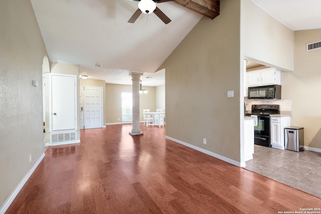 4010 Briarcrest, San Antonio, TX 78247 - unfurnished living room featuring light wood-style floors, decorative columns, visible vents, and a ceiling fan