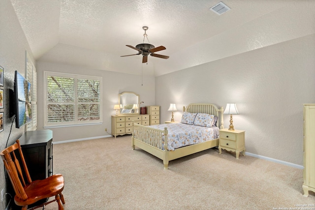 carpeted bedroom featuring lofted ceiling, visible vents, a textured wall, a textured ceiling, and baseboards