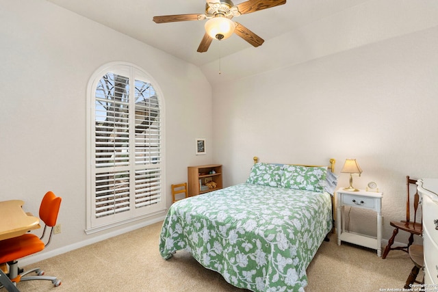 bedroom with lofted ceiling, carpet, baseboards, and a ceiling fan