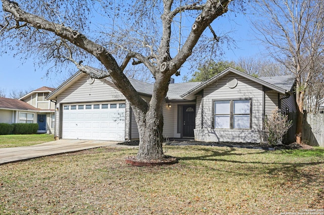 single story home with driveway, an attached garage, and a front yard