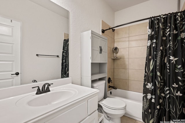 bathroom featuring a textured wall, tile patterned flooring, toilet, vanity, and shower / tub combo with curtain