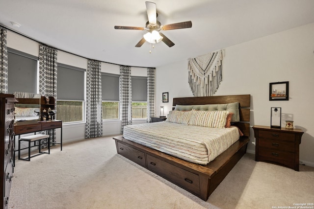 carpeted bedroom featuring a ceiling fan