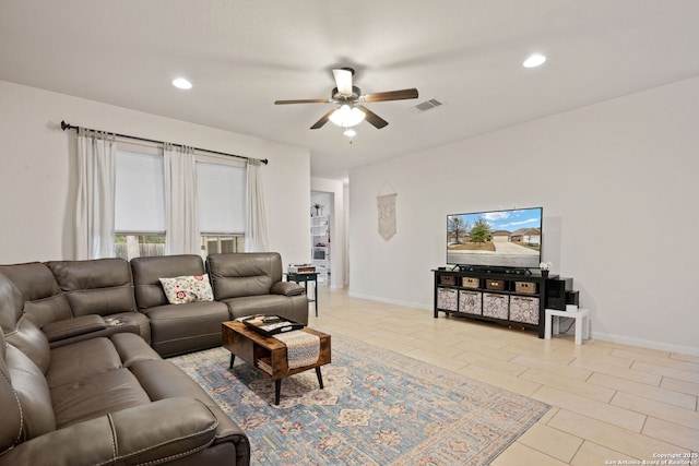 living room with ceiling fan, visible vents, baseboards, and recessed lighting