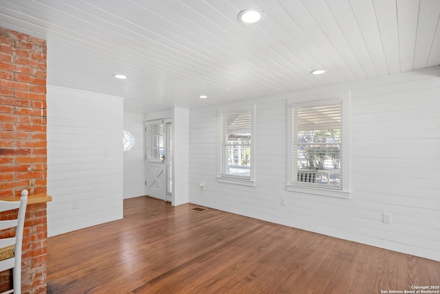 spare room featuring recessed lighting, wood ceiling, visible vents, and wood finished floors