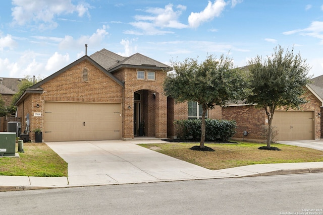 view of front of house with a garage, central AC unit, concrete driveway, a front lawn, and brick siding