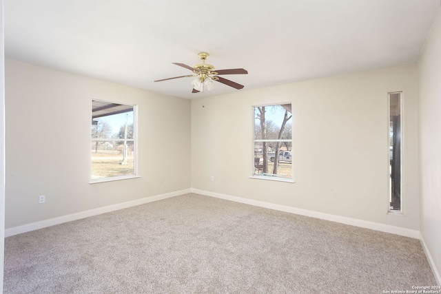 620 County Road 6846, Lytle, TX 78052 - carpeted empty room featuring a ceiling fan, plenty of natural light, and baseboards