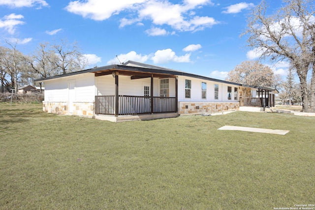 620 County Road 6846, Lytle, TX 78052 - view of front of property with stone siding and a front lawn
