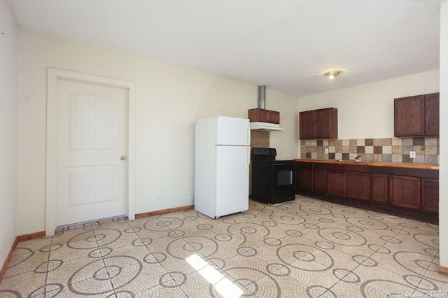 620 County Road 6846, Lytle, TX 78052 - kitchen featuring baseboards, decorative backsplash, freestanding refrigerator, black electric range, and under cabinet range hood
