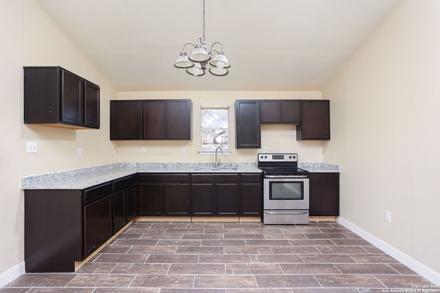 620 County Road 6846, Lytle, TX 78052 - kitchen featuring stainless steel range with electric stovetop, dark brown cabinets, and a sink