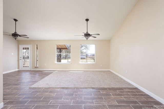 620 County Road 6846, Lytle, TX 78052 - empty room with ceiling fan, baseboards, and vaulted ceiling