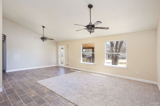620 County Road 6846, Lytle, TX 78052 - unfurnished living room featuring ceiling fan, lofted ceiling, and baseboards