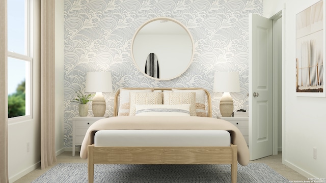 bedroom featuring wallpapered walls, carpet, and baseboards