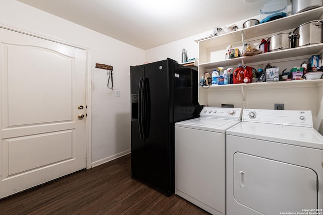 washroom featuring dark wood-type flooring, laundry area, independent washer and dryer, and baseboards