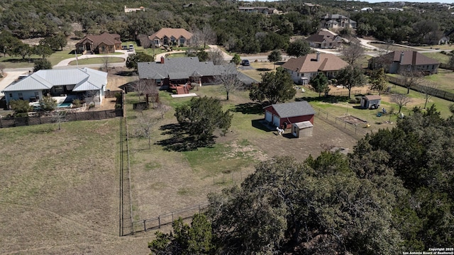 birds eye view of property with a residential view