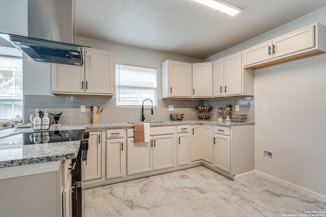 kitchen featuring marble finish floor, electric range, island exhaust hood, and a sink